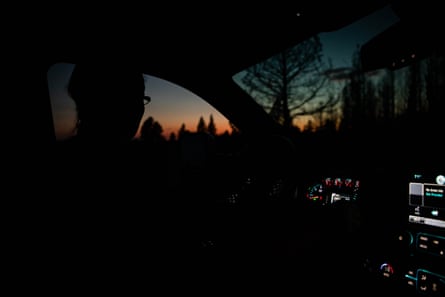 Valerie O'Dai drives her truck in the near dark in Bly, Oregon.