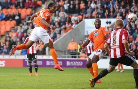 Nathan Delfouneso heads home to score Blackpool’s first goal against Brentford in August 2014.