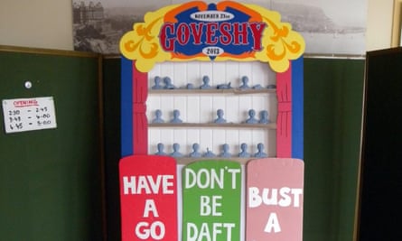 Shelves of little blue busts, with signs below reading ‘Have a go at Gove’, ‘Don’t be daft keep craft’ and ‘Bust a bust’.