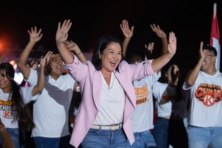 Keiko Fujimori waves to supporters at an election rally