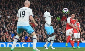 Mesut Özil fires a curling left-footed towards goal to give Arsenal the lead against West Ham.