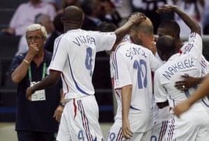 The Italy coach, Marcello Lippi, looks on as the French players celebrate Zidane’s goal in the final.