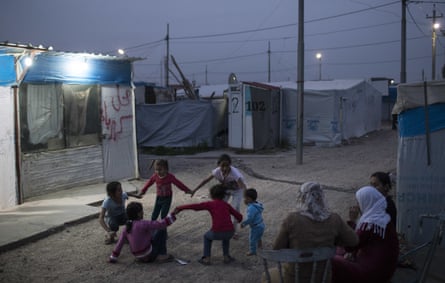 Syrian children play outside their tents in the Kawergosk refugee camp in northern Iraq.