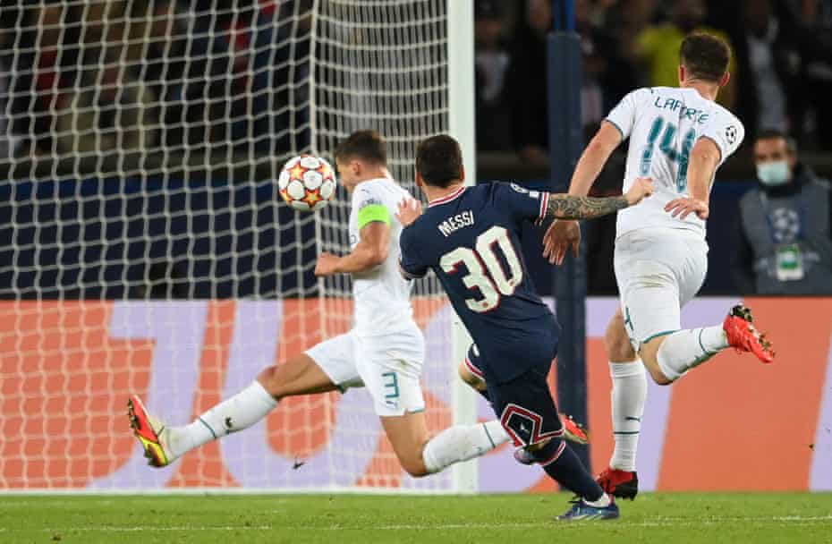 Lionel Messi guides his shot into the roof of the nets.