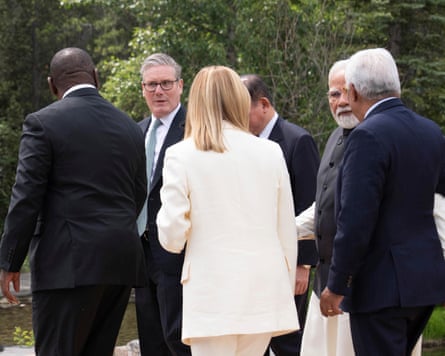 Keir Starmer, second left, makes his way for a group photo at the G7 Leaders’ Summit in Kananaskis, in Alberta, Canada