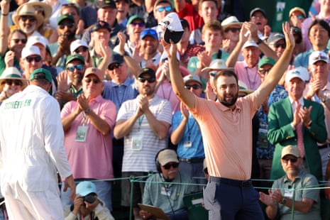 Scottie Scheffler celebrates on the 18th green after winning the 2024 Masters.
