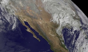 A Nasa satellite image showing the snow storm looming over the US east coast.