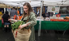 Kathryn Kellogg, a "zero waste" practitioner, purchases vegetables at a farmer's market in Vallejo, CA, on April 9, 2016. Zero waste practitioners attempt to generate as little landfill waste as possible; they even view recycling as a last resort. For example, Kellogg tries to only buy second-hand clothing and goods and shops for groceries at farmers markets or bulk-food stores, using reusable cloth sacks and glass jars to carry and store food. Kellogg says it took her several years to transition into practicing zero waste, and  believes the fact that she is a vegetarian and largely lactose intolerant also helps.