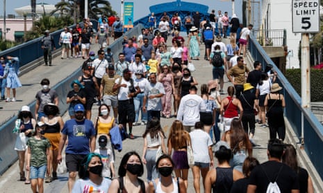 People walk in Santa Monica, California. The Census Bureau results showed that US metro areas accounted for almost all the country’s population growth.