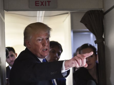 Man points with others behind him
