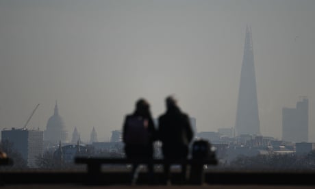 St Paul's Cathedral and the Shard seen through the smog from Primrose Hill in north London