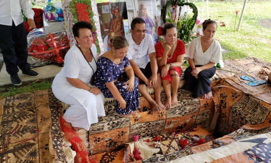 The author (right) with her siblings at the grave of their mother, wrapped in tapa cloth, as per Samoan traditional practice.