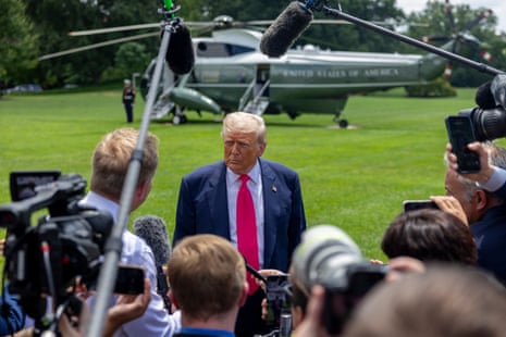 President Trump speaks to reporters on the White House lawn before boarding Marine One