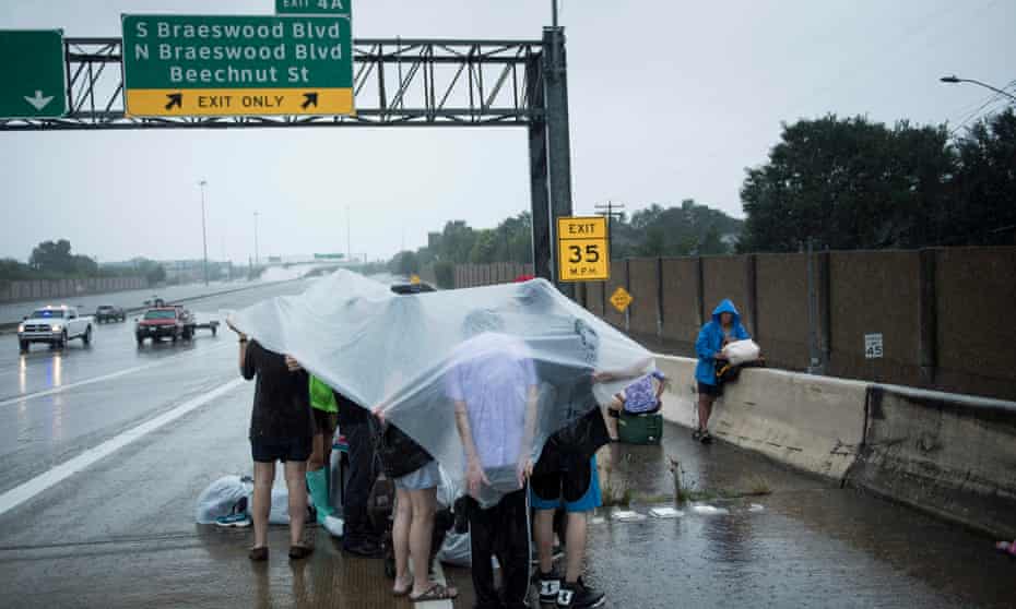 Evacuation residents from Meyerland wait on an I-610 overpass for further help during the aftermath of Hurricane Harvey.