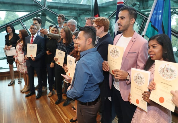 Refugee footballer Hakeem Al-Araibi (second from right) receives his Australian citizenship during a ceremony at Federation Square in Melbourne.