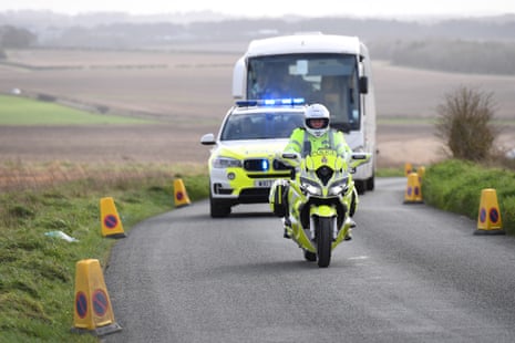 Diamond Princess evacuees depart from Boscombe Down airfield with a police escort