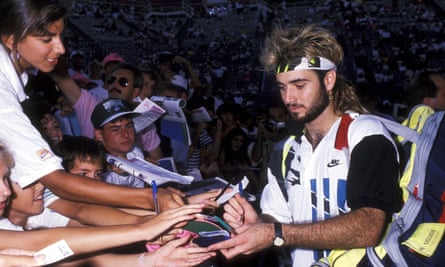 Andre Agassi signs autographs for fans at the 1990 US Open