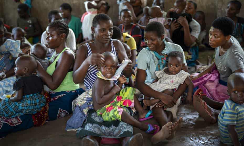 Children in Malawi wait to be injected with a vaccine against malaria in a WHO pilot project. It fears Covid may have set back its efforts by 20 years.