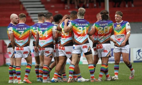 Keighley Cougar players, wearing a Pride-inspired kit, celebrate during the Pride match against Coventry Bears last year.