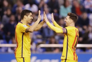 Messi celebrates with Suarez.