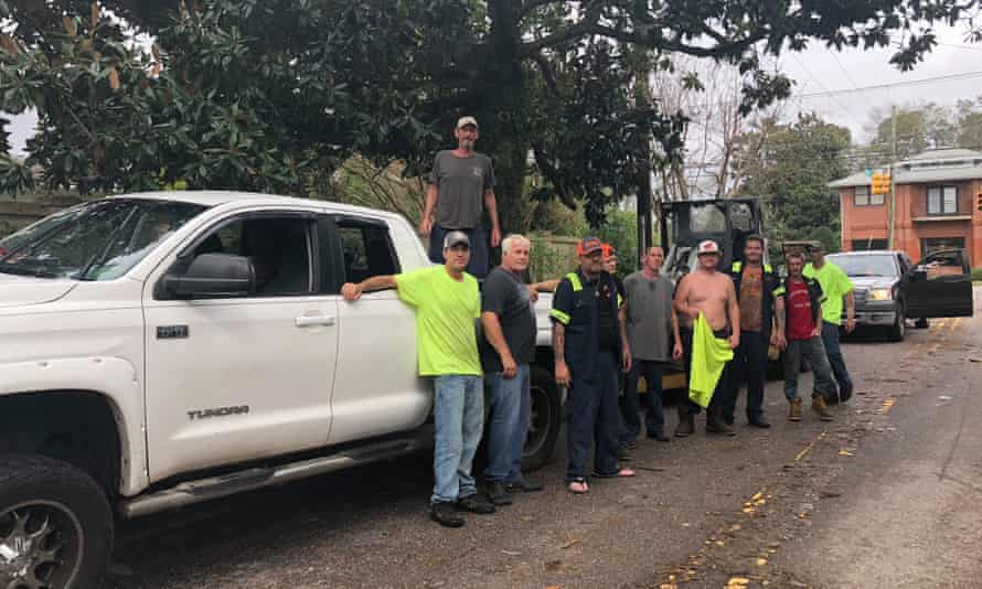 Men who have come to Wilmington, North Carolina, from other parts of the state to help with the recovery process.