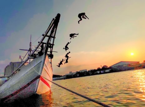 Image of children playing by jumping off a boat in the Sunda Kelapa harbour, in North Jakarta, Indonesia, with the sun nearly setting. Entitled Break the Limit it was shot in 2023 on a Xiaomi 11 Lite 5G NE.