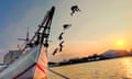 Image of children playing by jumping off a boat in the Sunda Kelapa harbour, in North Jakarta, Indonesia, with the sun nearly setting. Entitled Break the Limit it was shot in 2023 on a Xiaomi 11 Lite 5G NE.Jelly Fabrian is shortlisted in the Open Competition, Sony World Photography Awards 2024, exhibition at Somerset House 19 April – 6 May, worldphoto.org