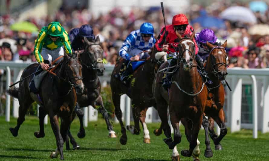 Jockey Paul Hanagan on The Riddler as he finishes first past the post in the Norfolk Stakes.