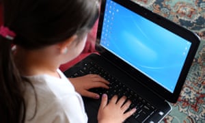 A child at a computer.