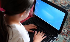 A child using a laptop computer