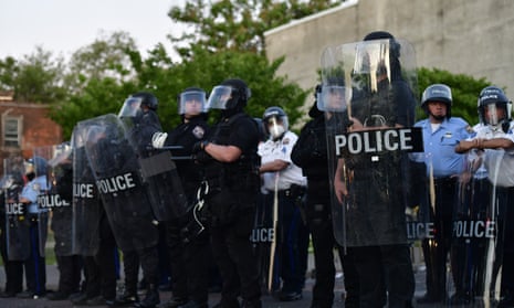 Police create a barrier during widespread unrest following the death of George Floyd, 31 May 2020 in Philadelphia.