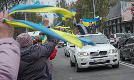Local residents celebrate after Russia’s retreat from Kherson, in central Kherson, Ukraine.