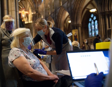 Audrey Elson, 84, receives an injection of the Oxford/AstraZeneca coronavirus vaccine at Lichfield Cathedral.