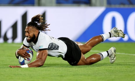 Waisea Nayacalevu of Fiji scores his team's first try.
