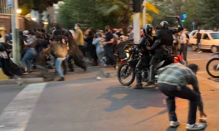 Iranian police officers attempting to disperse a protest for Mahsa Amini in Tehran, 19 September 2022