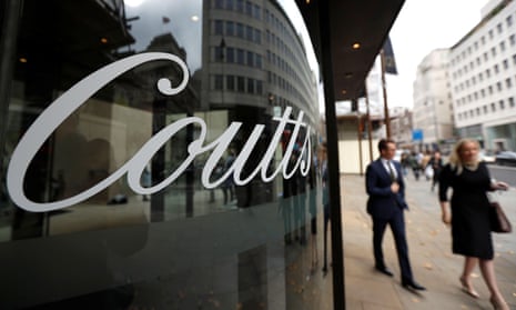 People walk past Coutts private bank in London