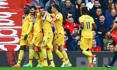 Christian Benteke, far left, celebrates Crystal Palace’s winning goal against Liverpool at Anfield with his team-mates.