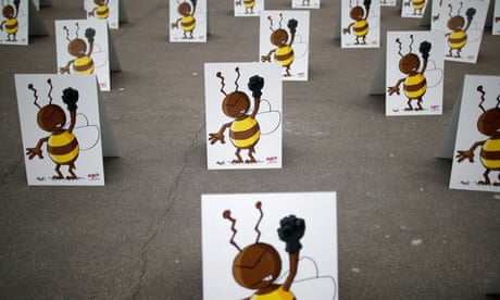 Environmental activists protest near the Conseil d’Etat as it will rule on a request by campaigners for the suspension of a government decision to ease a ban on bee-killing neonicotonoid pesticides in Paris, France, March 9, 2021. REUTERS/Gonzalo Fuentes