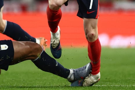 Ronald Araujo (L) fouls England's midfielder Phil Foden