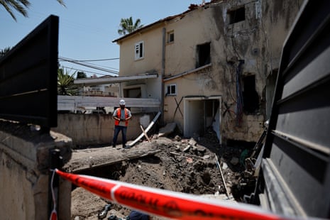 A worker inspects the damage around a building that was hit in a drone attack from Iran on Israel, in Beit Shean, in the Jordan valley, on Saturday.
