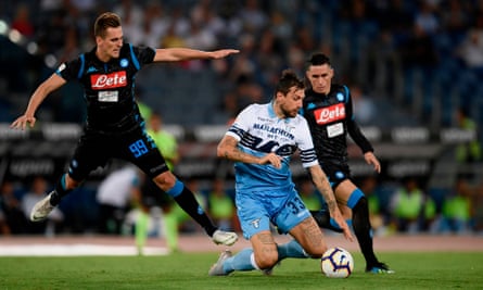 Napoli’s Arkadiusz Milik challenges Lazio defender Francesco Acerbi.