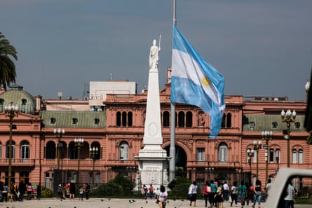 An Argentine flag flies at half mast on Plaza de Mayo in front of Casa Rosada in tribute to Diego Maradona.