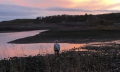 Rachel Keenan looks out at a colourful sky at dusk on the coast of Inverbervie.