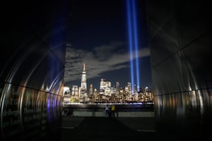 Two beams of light are shone into the night sky from Manhattan