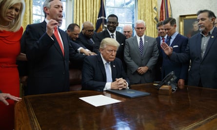 Religious leaders pray with Donald Trump after he signed a proclamation for a national day of prayer.
