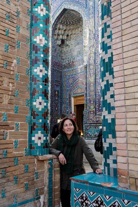 Mishal Husain standing in an arch inside a richly tiled building