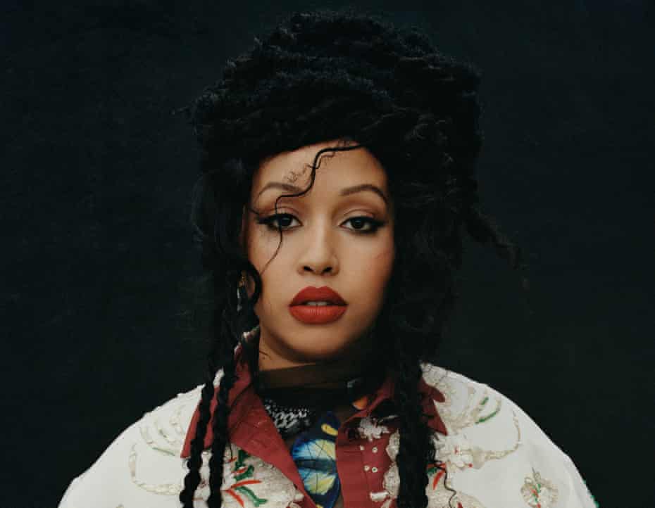 Head shot of poet Warsan Shire against black background, Los Angeles, January 2022
