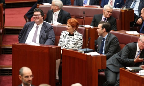 The member for Dawson, George Christensen, sits next to One Nation senator Pauline Hanson with the resources minister, Matt Canavan, on the right