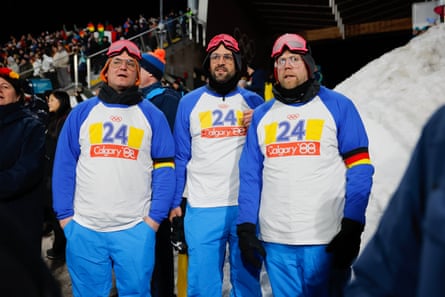 German fans enjoy the ski jumping at Predazzzo.
