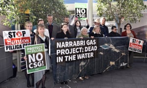Protesters gather outside the Santos AGM in Adelaide on Thursday.